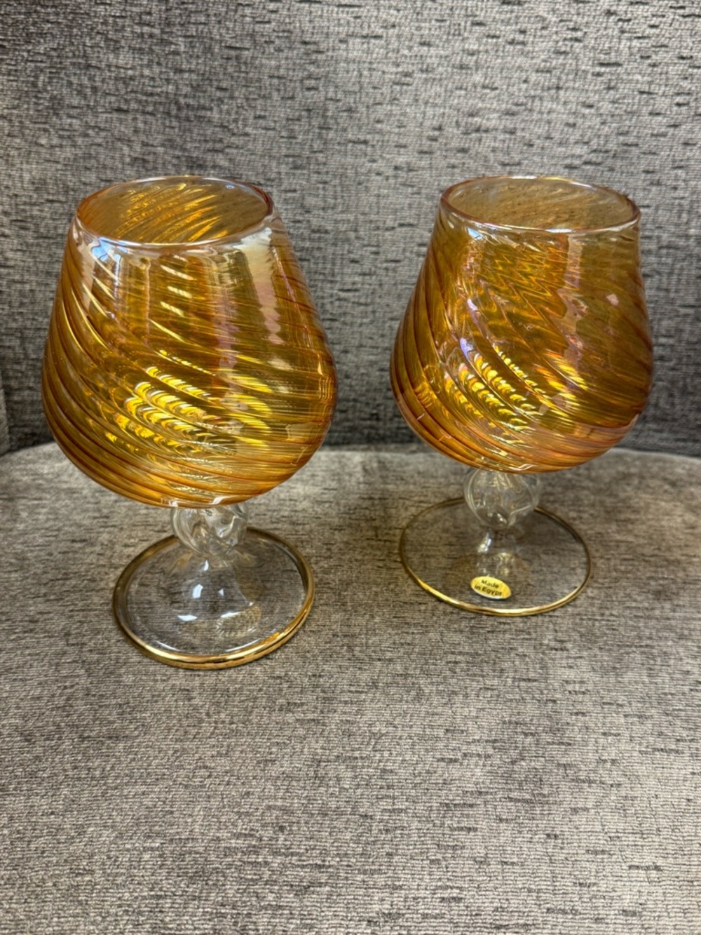Pair of Egyptian Amber Swirl Iridescent Carnival Glass Brandy Snifters.